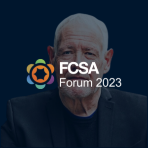 Photo of Chris Bryce FCSA CEO, behind FCSA Forum 2023 logo